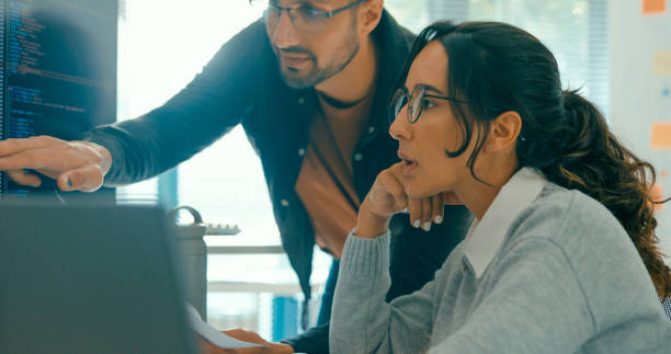 istock Closeup of tech team professionals collaborate discuss software development strategies in modern office. Software developer, artificial intelligence and programming. 2149809176