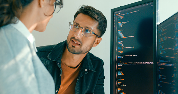 Closeup Of Software Engineering Team Engaged In Problemsolving And Code ...