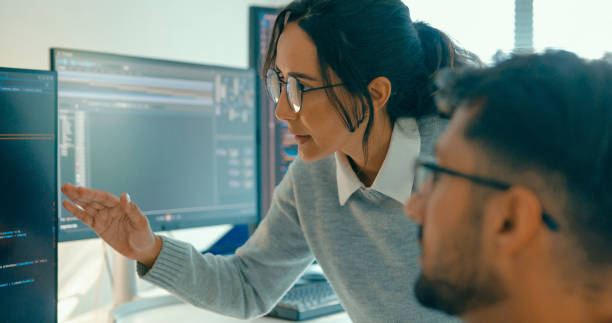 istock Closeup of tech team professionals collaborate discuss software development strategies in modern office. Software developer, artificial intelligence and programming. 2149809188