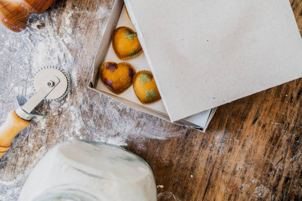 Close-up of heart-shaped ravioli inside a semi-open box on the table