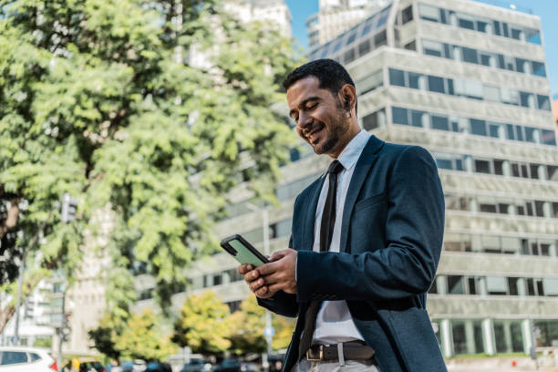 istock Businessman using mobile phone at the city 2149811841