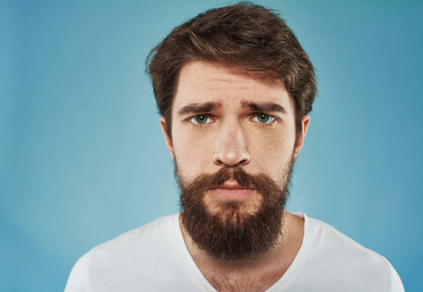 istock Sad man emotions white t-shirt cropped view close-up 2149812401
