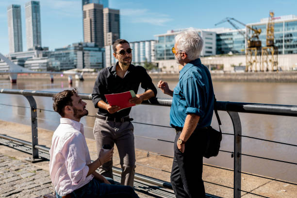 istock Businessmen talking in the city 2149812520