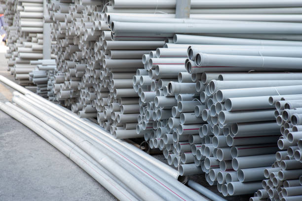 istock PVC pipes stacked in warehouse. 2149812852
