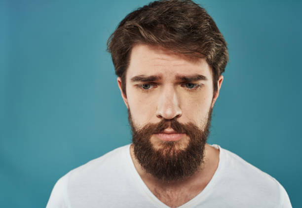 istock Sad man emotions white t-shirt cropped view close-up 2149812855