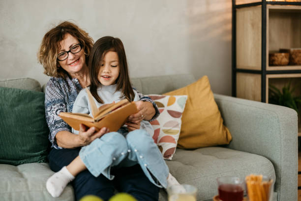 istock Grandma is reading a book to her grandson 2149812915