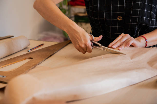 istock Close-up of a woman using scissors on an atelier 2149812971