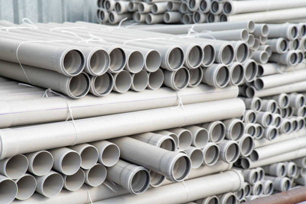 istock PVC pipes stacked in warehouse. 2149813007