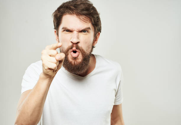 istock Aggressive man gestures with his hands on a light background stress emotions irritability 2149813042