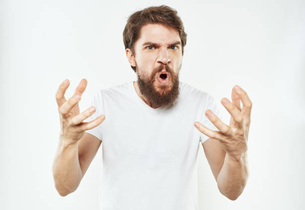 istock An emotional man on a light background gestures with his hands Copy Space irritability 2149813089
