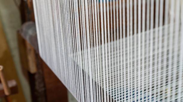 istock Strings of thread in a carpet factory 2149815675