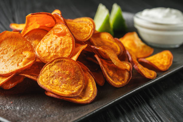 istock sweet potato chips on a dark wooden rustic background 2149815691