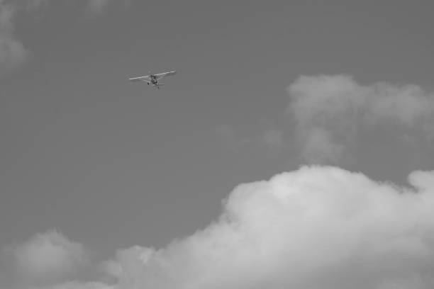istock small plane doing pirouettes in the cloudy sky 2149816733