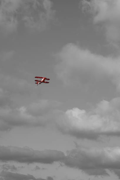 Old fighter biplane in flight. 3D rendered illustration isolated on empty background.