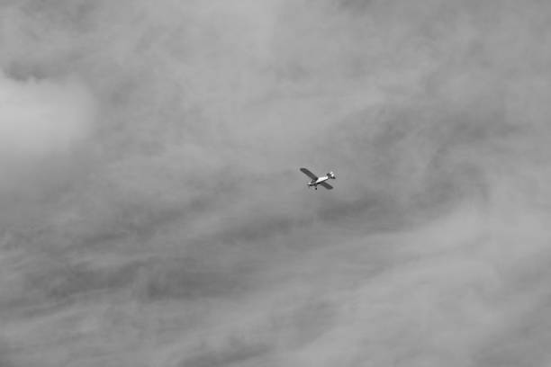 istock small plane doing pirouettes in the cloudy sky 2149816939