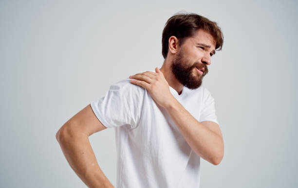 istock man has shoulder pain and white t-shirt dislocation health problems 2149817143