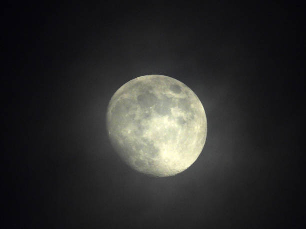 istock moon in waxing gibbous phase behind misty clouds 2149817683