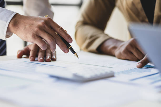 istock Financial advisor meeting analyzing finance numbers, accounting for income and expenses, and planning financial budgets. 2149817708