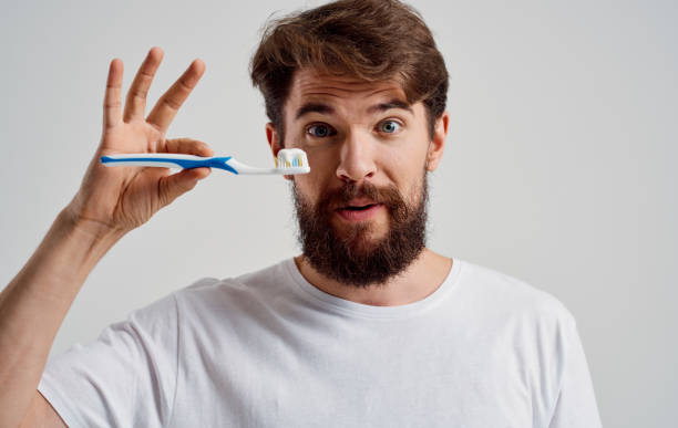 istock man with a toothbrush in his hands oral cavity care toothpaste model 2149817812