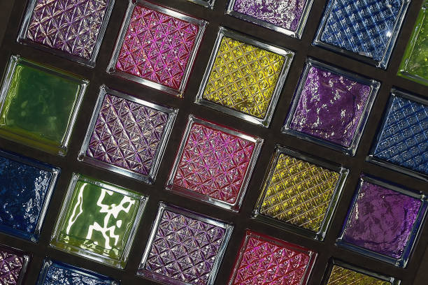 Multicolored glass stained glass blocks on exhibition stand. Interior