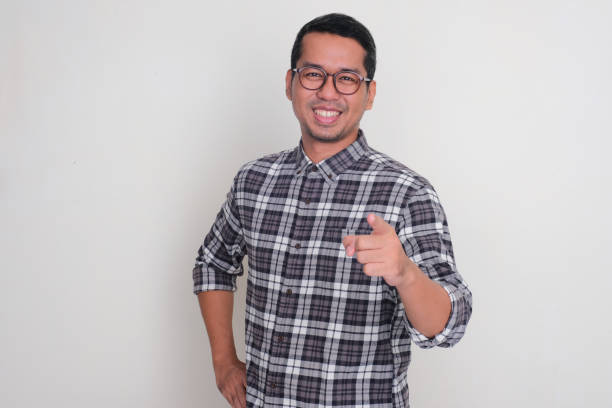 istock A man smiling and pointing at the camera with confidence 2149819632