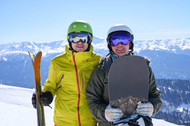 istock Skiing and Snowboarding Buddies on Alpine Slope 2149820942