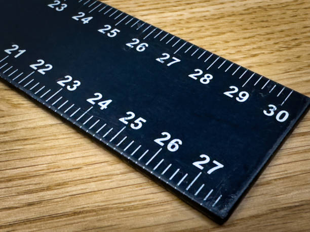 istock Black ruler on a wooden worktop 2149821896