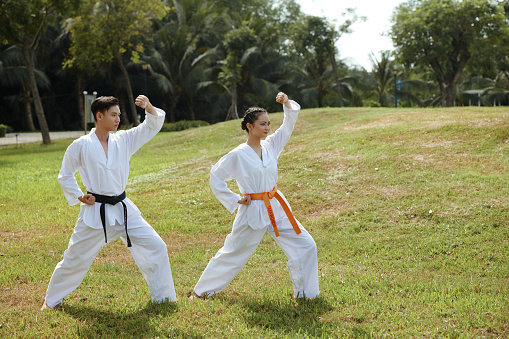 Young taekwondo athletes practicing fighting stance
