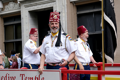 Norfolk, Virginia:  USA:  April 20th, 2024, At the 75th anniversary of the NATO parade in downtown Norfolk, Virginia the Shriners ride among their various floats.