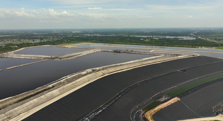 Aerial view of large open air phosphogypsum waste stack near Tampa, Florida. Potential danger of disposing byproduct of phosphate fertilizer production