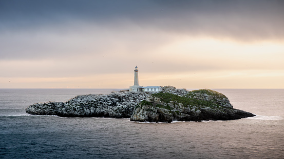 Sunrise over Isla de Mouro's lighthouse (Santander, Spain)