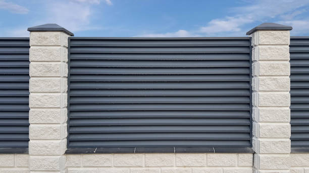 istock Modern gray metal shutter fence with stone column 2149824453
