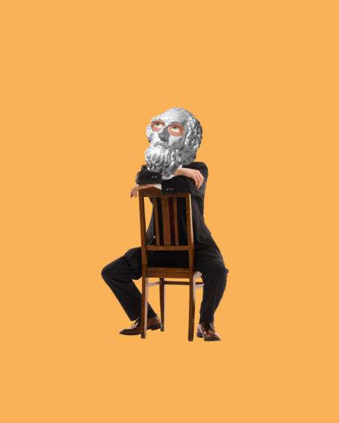 Man with antique statue bust, in suit sitting on chair with thoughtful expression. Contemporary art collage. Seeking answers