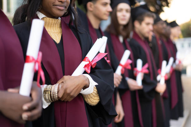 istock Graduation gowns and diplomas 2149827165