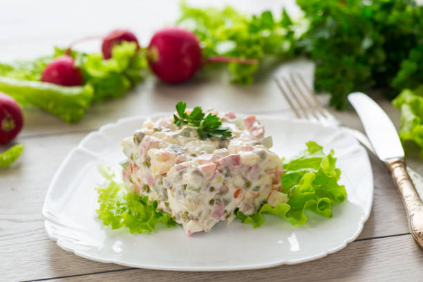 vegetable salad with boiled vegetables and dressed with mayonnaise