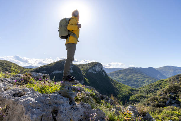 istock Senior hiker pauses on mountain top 2149827954