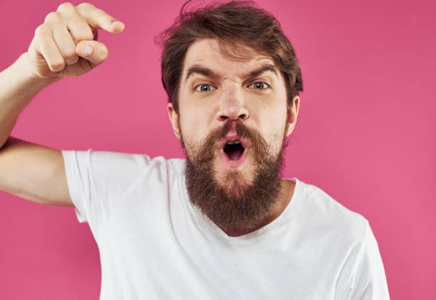 istock Man on pink background stress irritability aggression gesticulating with hands cropped view 2149829221