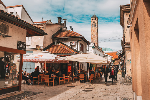 15 March 2024, Sarajevo, Bosnia and Herzegovina: Iconic Sahat Tower rises majestically amidst Sarajevo's historic bazaar, a must-see attraction blending Ottoman charm with European allure.