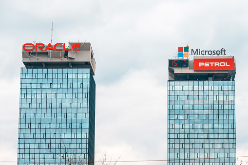 15 March 2024, Sarajevo, Bosnia and Herzegovina: modern office buildings with Microsoft and Oracle's advertisement banners as a symbol of the city's growing presence in the technology industry.