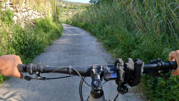 istock POV of e-biking up rural road 2149829517