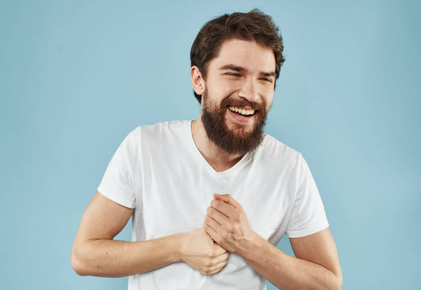 istock Handsome man with beard on blue background white t-shirt portrait cropped view 2149829556