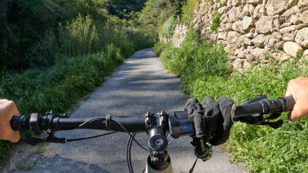 istock POV of e-biking up rural road 2149829590