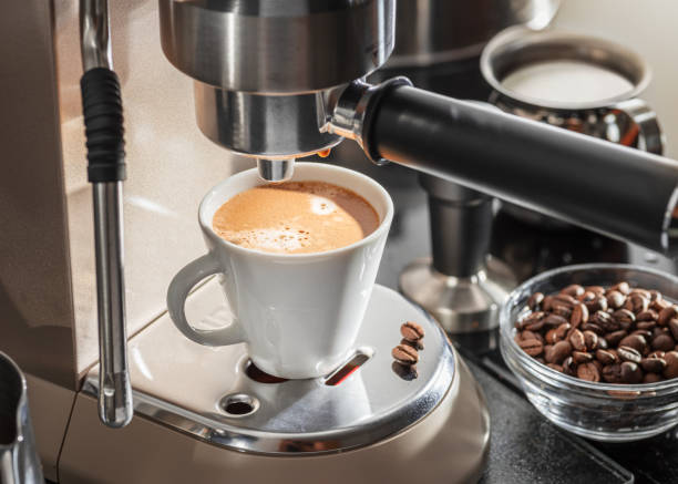 istock Automatic coffee machine. Pouring coffee into the coffee cup closeup. 2149831184