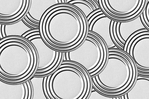Canned food background. Metal tin conserve can. Circular shape pattern.