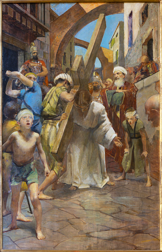 Treviso - The painting  Simon of Cyrene helps Jesus carry the cross as part of Cross way stations in the church La Cattedrale di San Pietro Apostolo by Alessandro Pomi