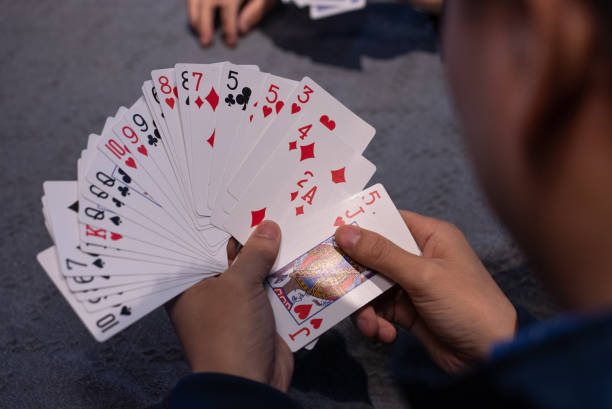 istock person playing paper cards 2149834462