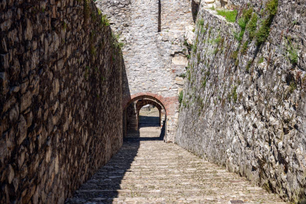 istock Stone steps lead through the secluded Strada del Soccorso, a passageway within the historical castle grounds of Brescia, revealing layers of history 2149834542