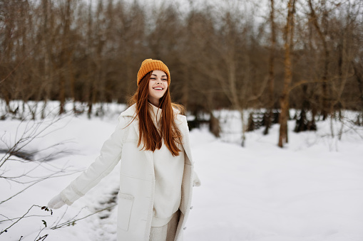 woman Walk in winter field landscape outdoor entertainment winter holidays. High quality photo