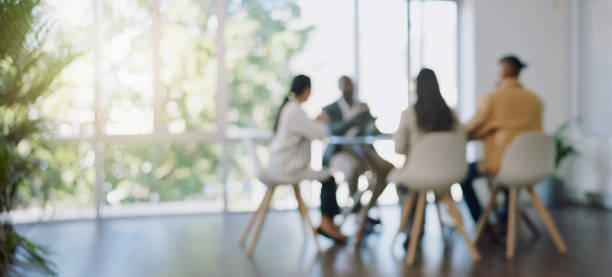 business meeting, blurred background and people in office for teamwork, collaboration and planning, partnership, negotiation and group in solidarity for growth, consulting and corporate solution - team imagens e fotografias de stock