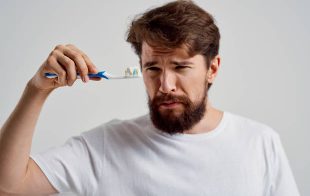 istock man with a toothbrush in his hands oral cavity care toothpaste model 2149838782